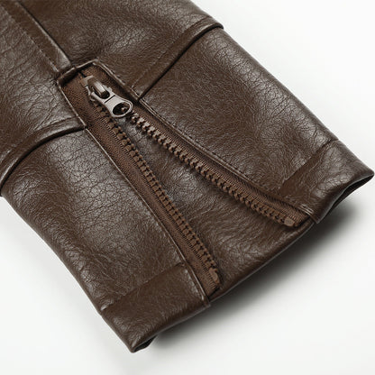 Detail of the sleeve and cuff on a brown faux leather biker jacket