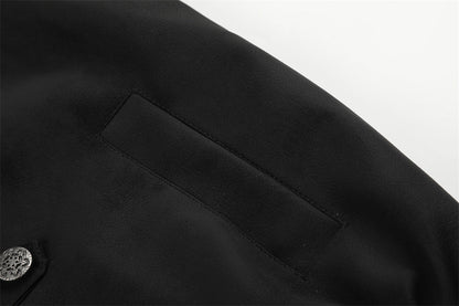 Black oversized outerwear with decorative silver buttons