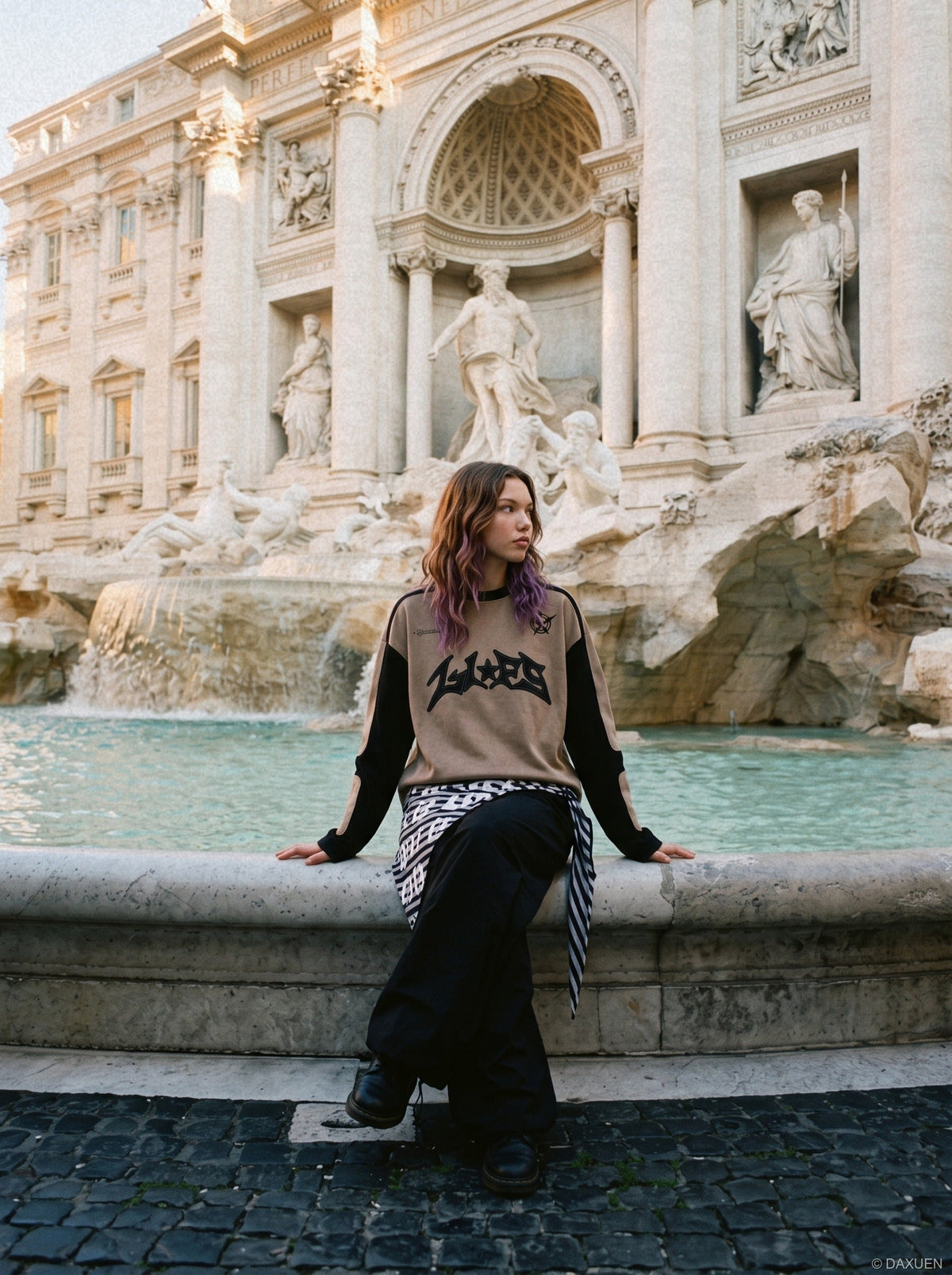 Long-sleeve top showing its bold graphic appliqué design