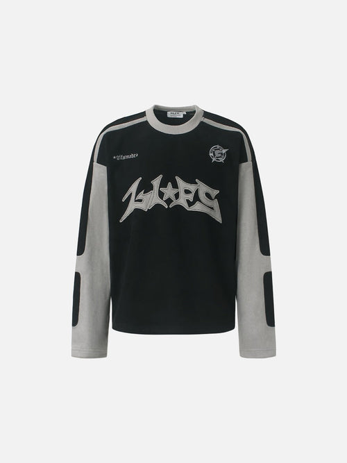 Graphic long-sleeve top with bold appliqué detail