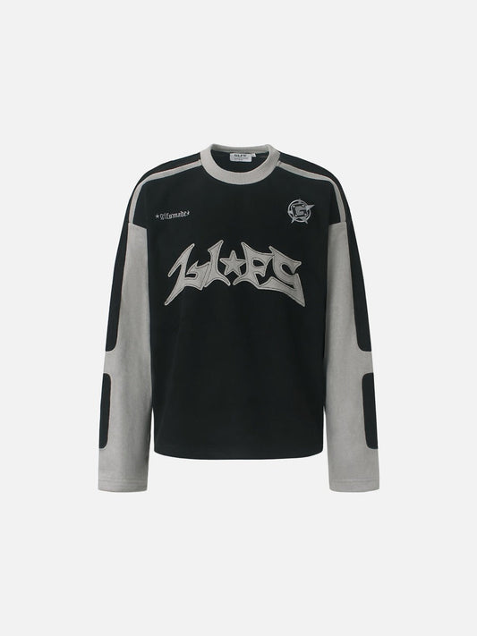 Graphic long-sleeve top with bold appliqué detail