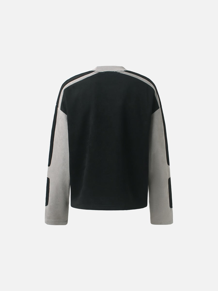 Detailed view of the neckline and appliqué graphic on the top