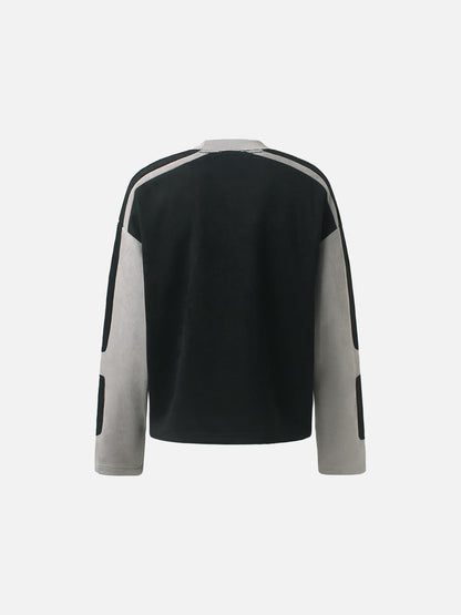 Detailed view of the neckline and appliqué graphic on the top