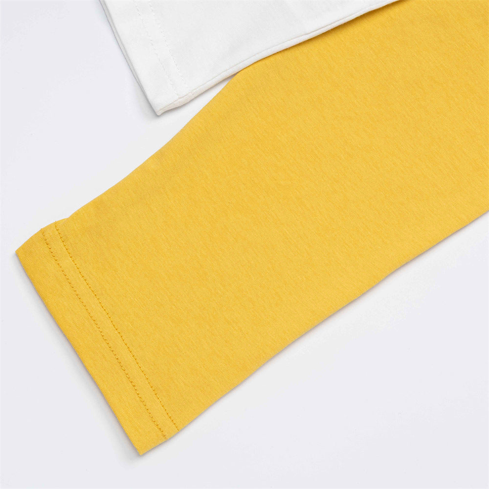 White and yellow raglan T-shirt styled for a casual outfit
