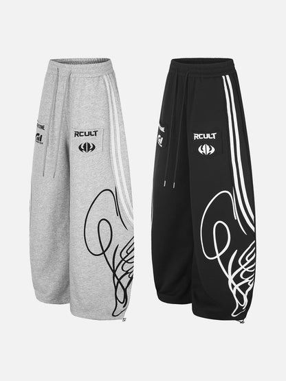 Graphic winged sweatpants in black and grey styled for casual streetwear