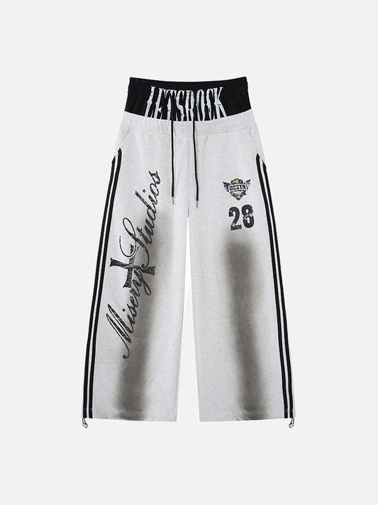Graphic wide-leg fleece sweatpants displayed from the front