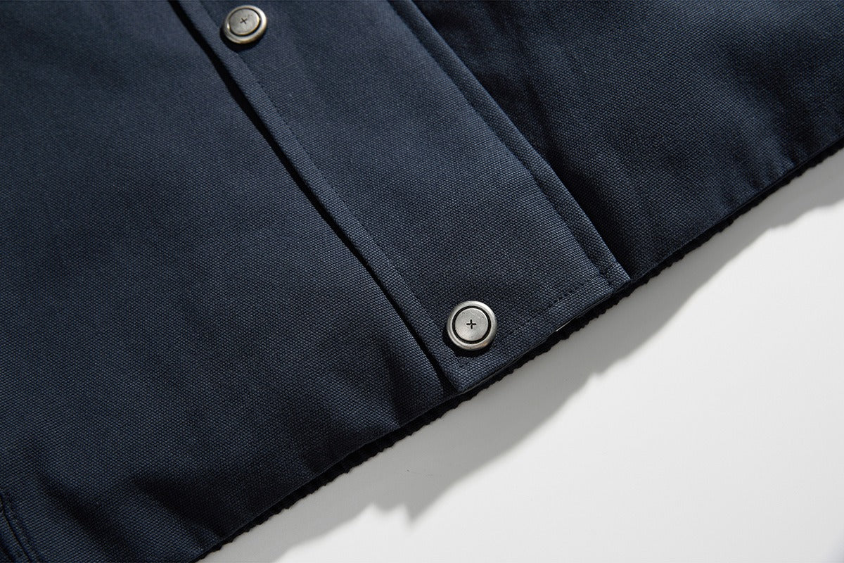 Side view of a navy jacket with a contrast collar