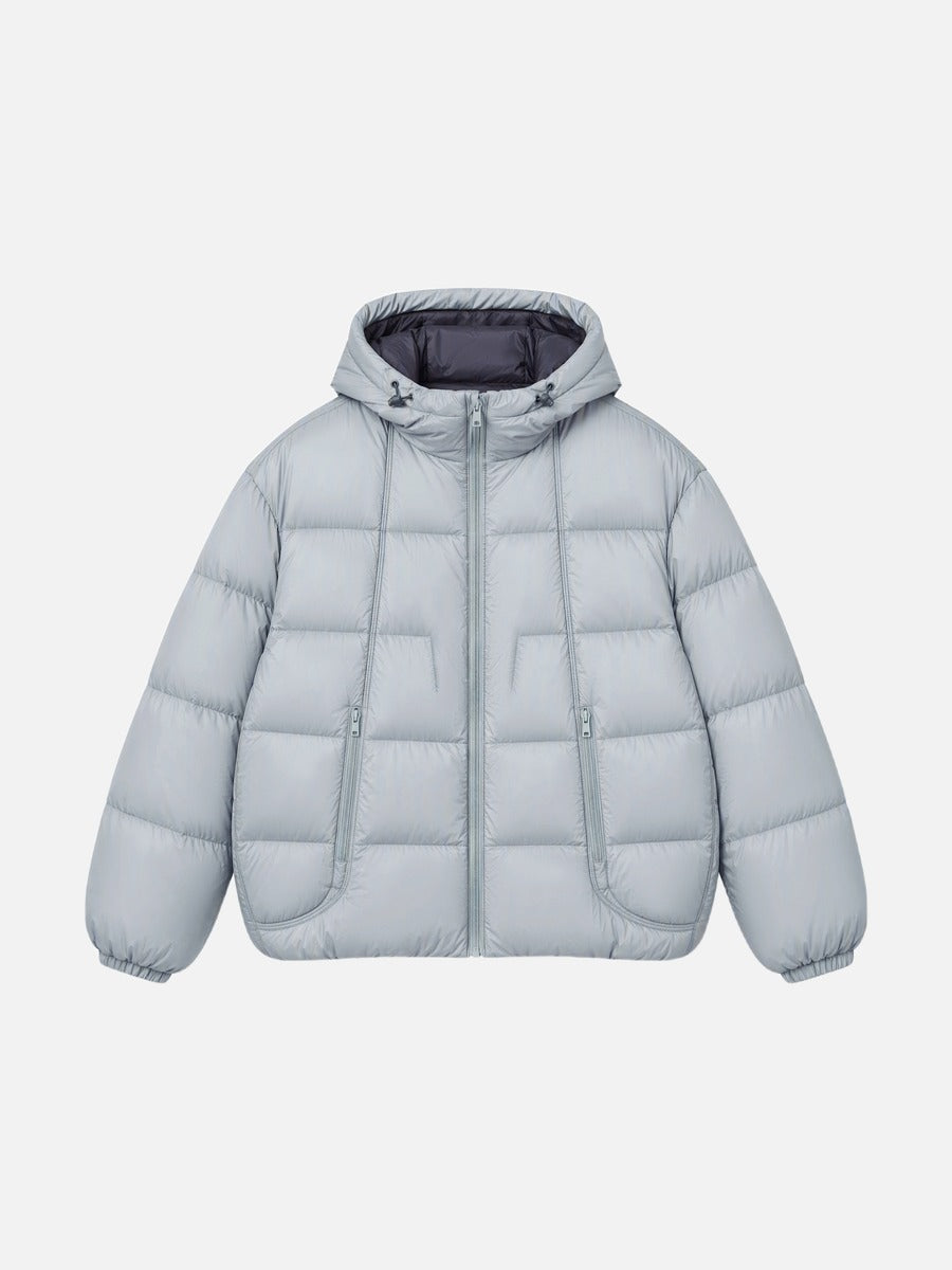 Side view of an oversized hooded puffer jacket with contrast lining