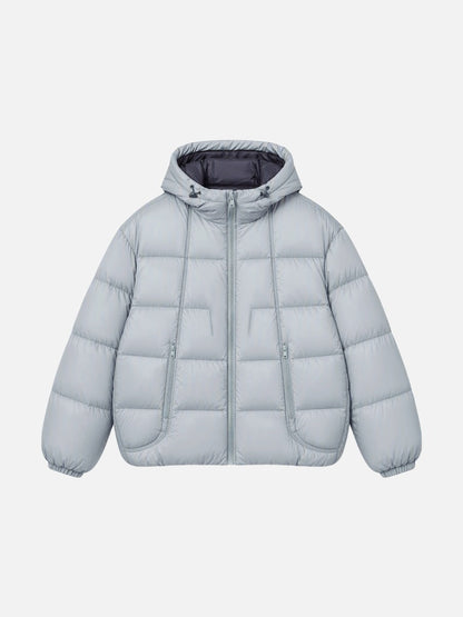 Side view of an oversized hooded puffer jacket with contrast lining