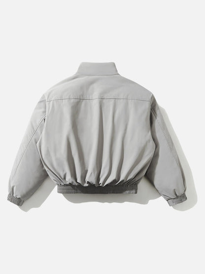 Cropped light grey jacket styled for everyday layering