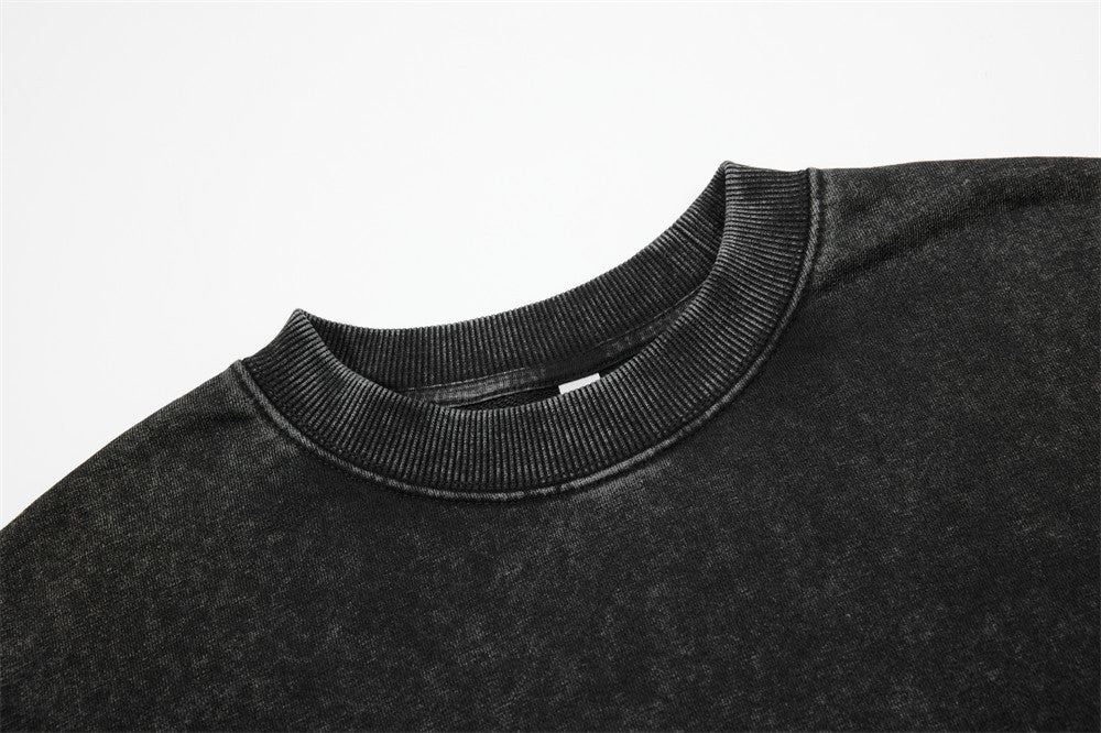 Side view showing the relaxed oversized fit of the sweatshirt