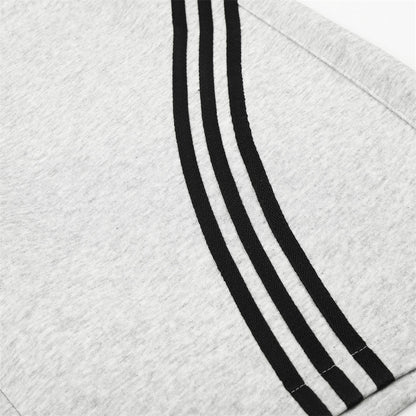 Striped wide-leg shorts styled for a casual everyday streetwear look
