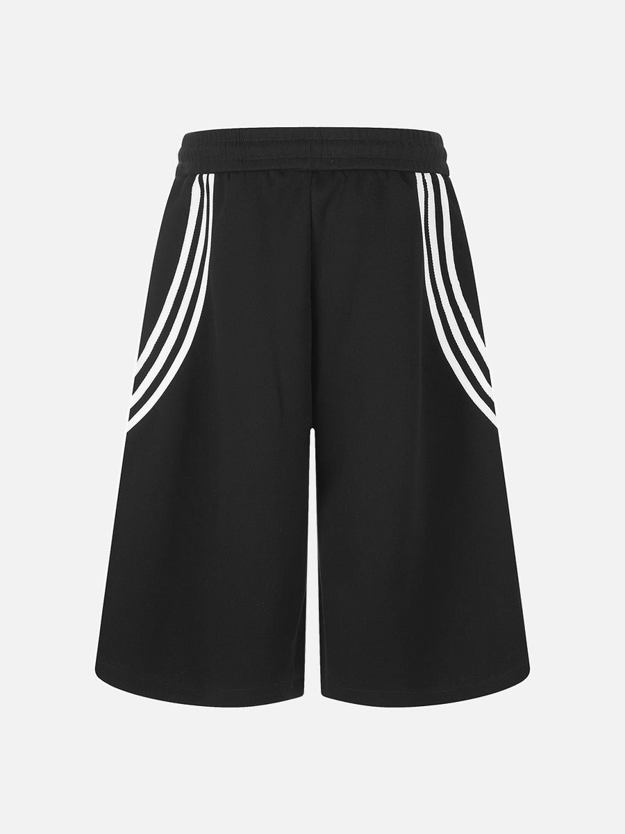 Model wearing striped wide-leg shorts with a relaxed loose fit