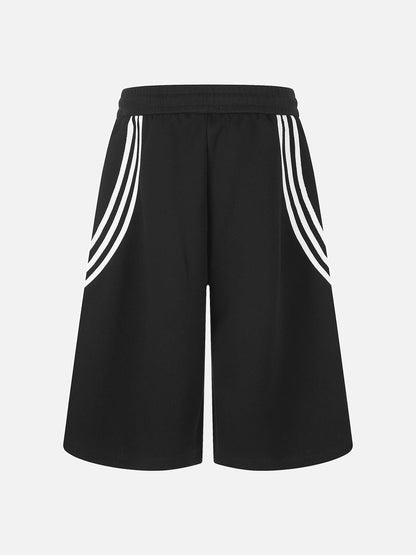 Model wearing striped wide-leg shorts with a relaxed loose fit