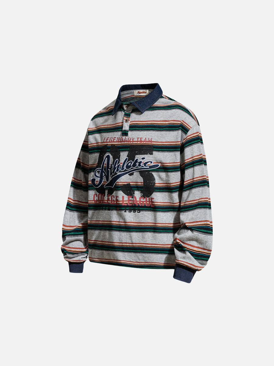 Full-length styling view of the oversized striped graphic polo shirt with casual outfit