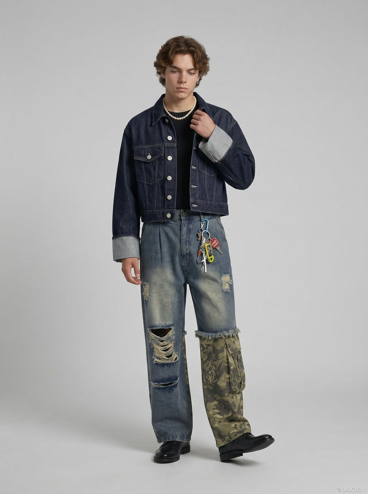 Full-length view of casual distressed camouflage jeans