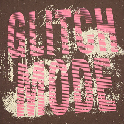 Fabric texture of distressed pink graphic T-shirt with layered look