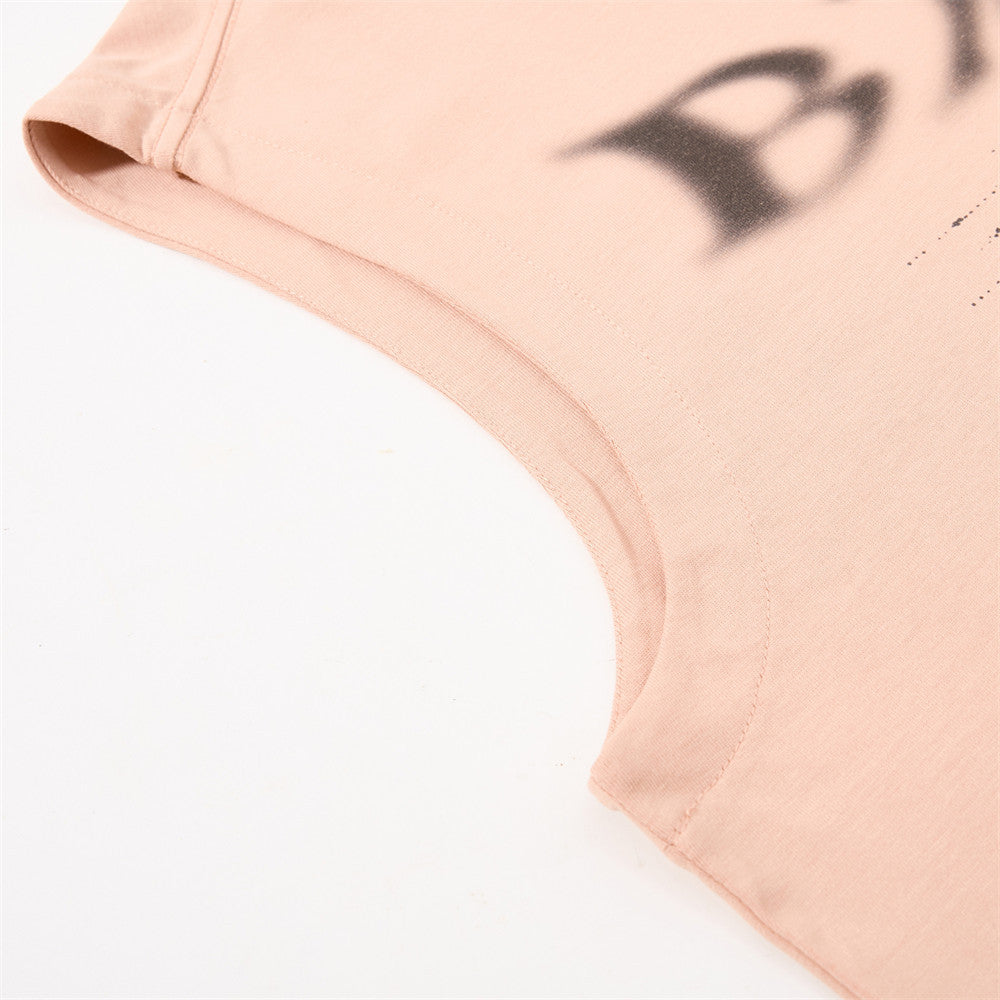 Full-length styling view of distressed graphic muscle tee