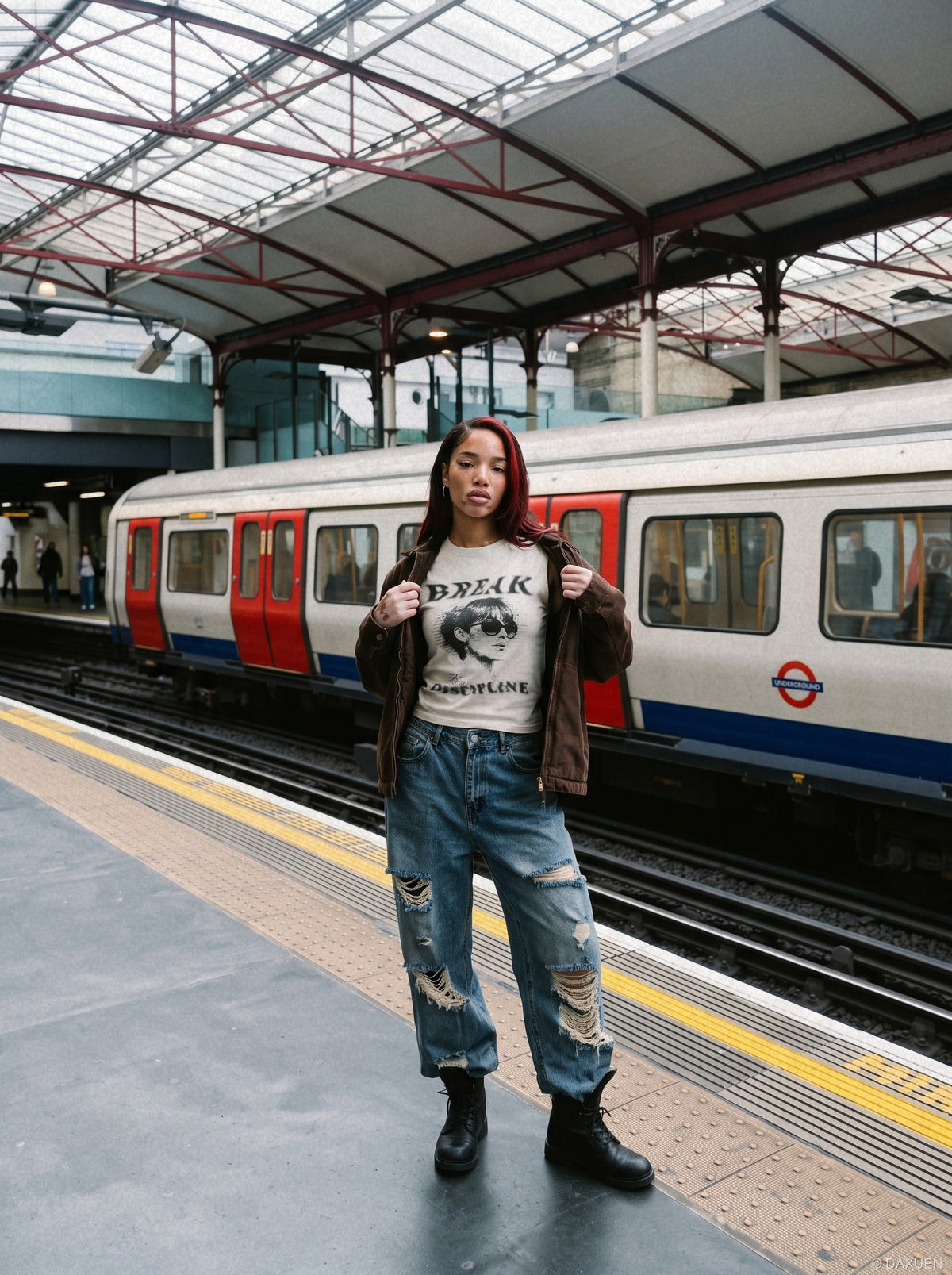 Model wearing distressed graphic muscle tee from the front