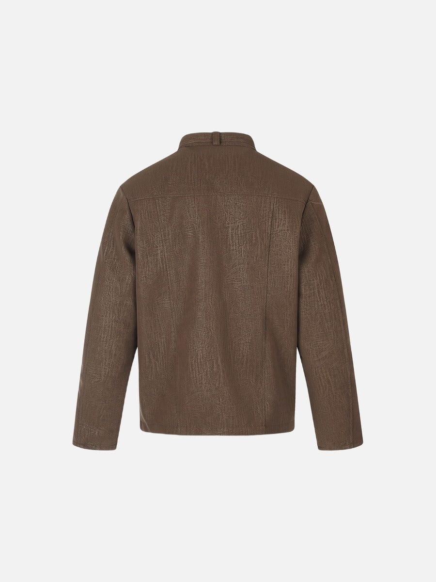 Boxy brown jacket with a structured collar and long sleeves