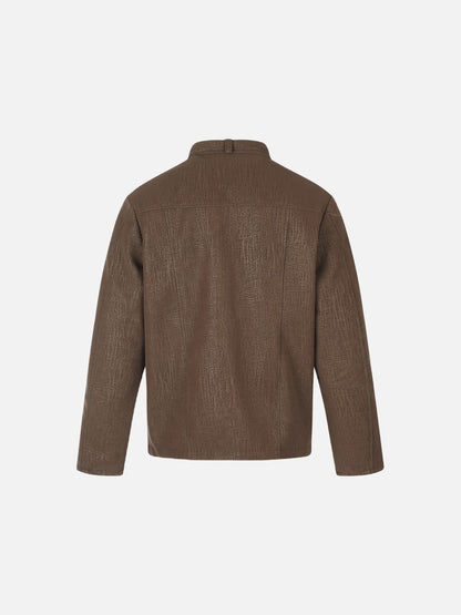 Boxy brown jacket with a structured collar and long sleeves