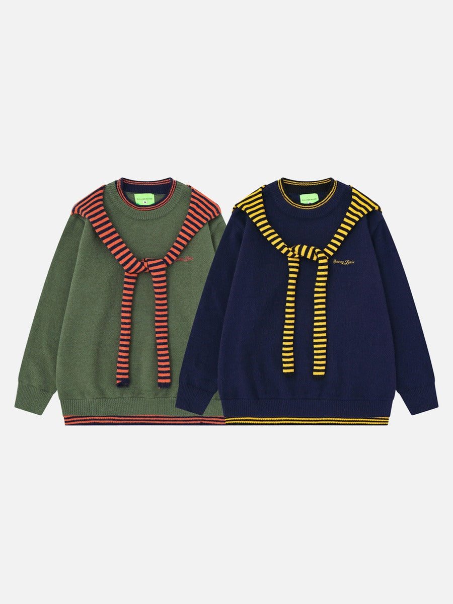 Side view of the olive and navy draped knit sweater
