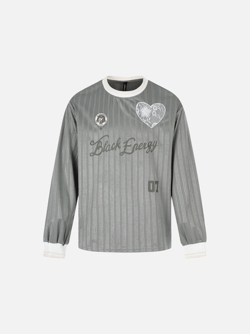 Front view of oversized jersey T-shirt with embroidered crest