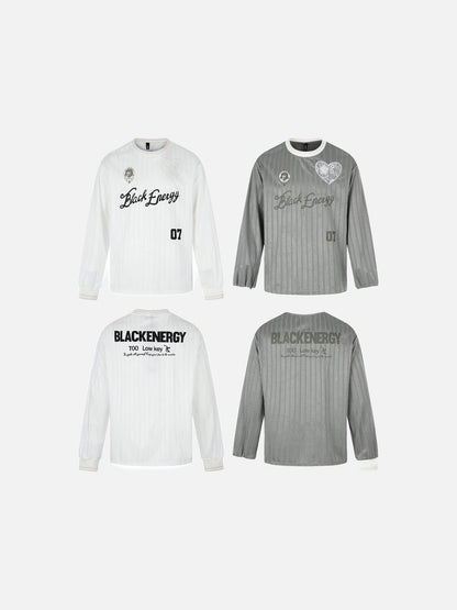Folded oversized jersey T-shirt showing embroidered crest