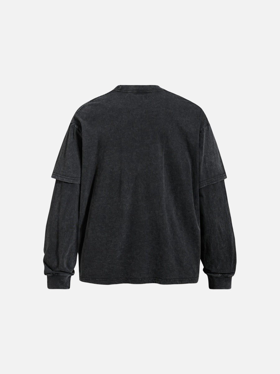 Close-up of the layered graphic detail on a faded grey T-shirt