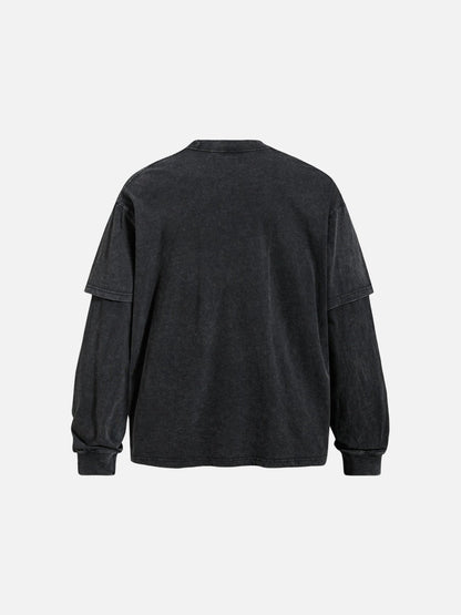 Close-up of the layered graphic detail on a faded grey T-shirt