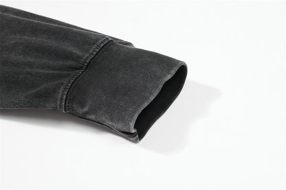 Detail view of the printed layered graphic on the faded grey tee