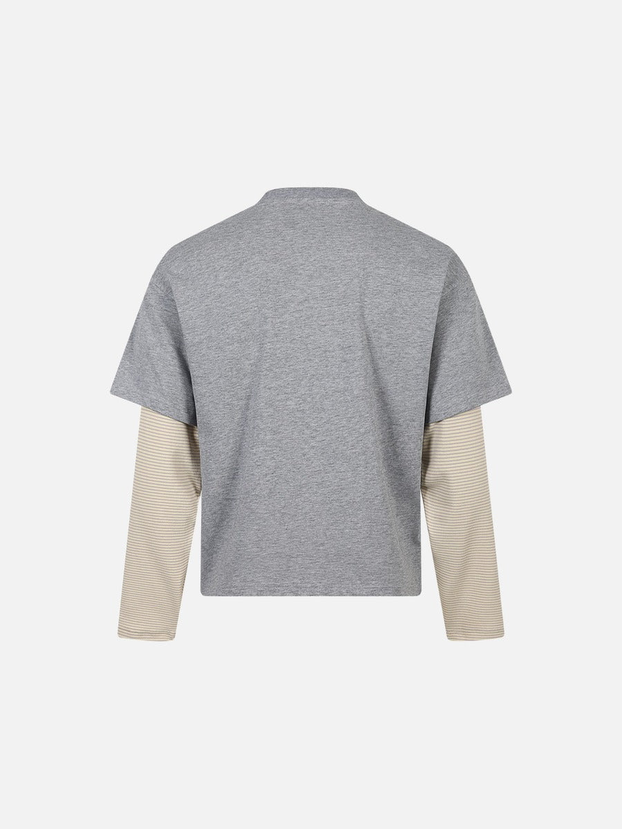 Streetwear-inspired oversized T-shirt with a cartoon cat design