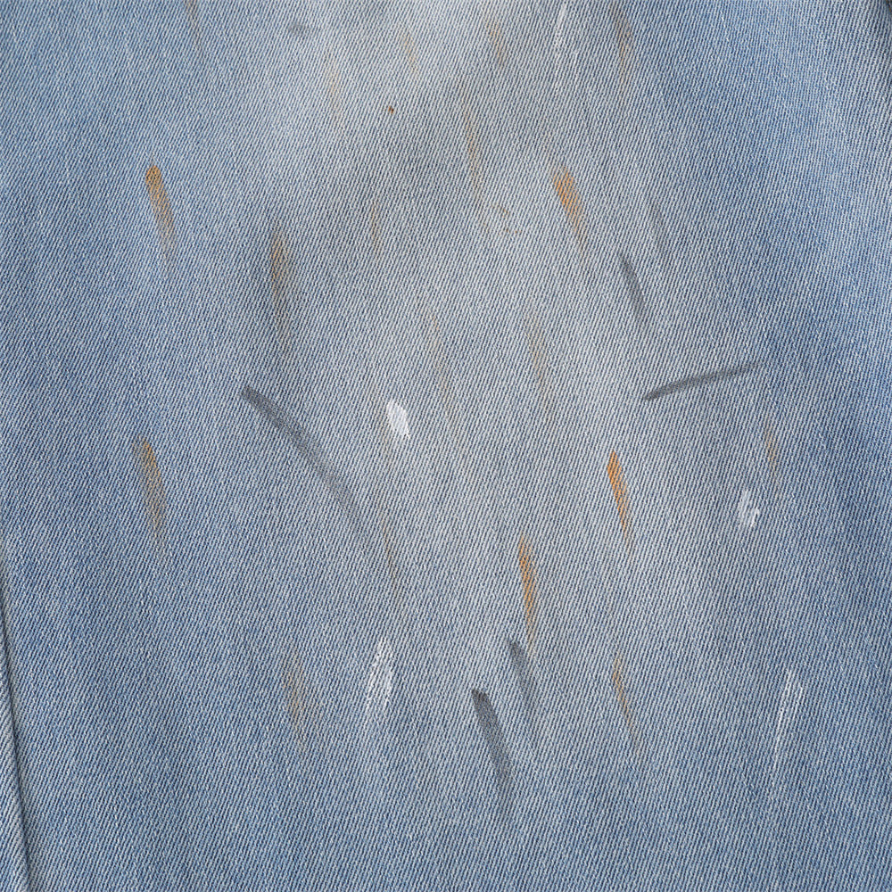 Close-up of waistband and front fastening on denim culotte shorts