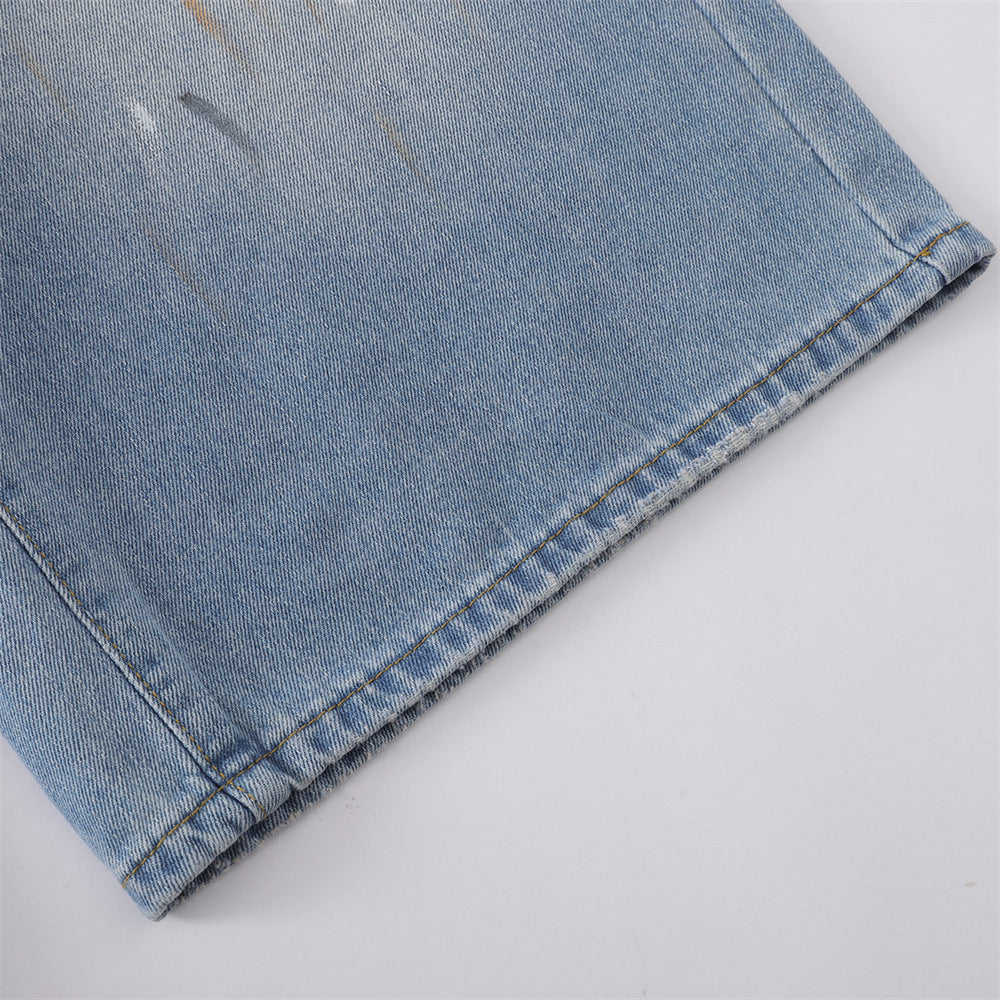 Close-up of wide culotte leg and faded wash on denim shorts