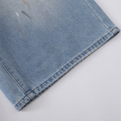 Close-up of wide culotte leg and faded wash on denim shorts