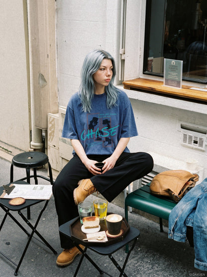 Side view of oversized graphic T-shirt with faded pixel graphic