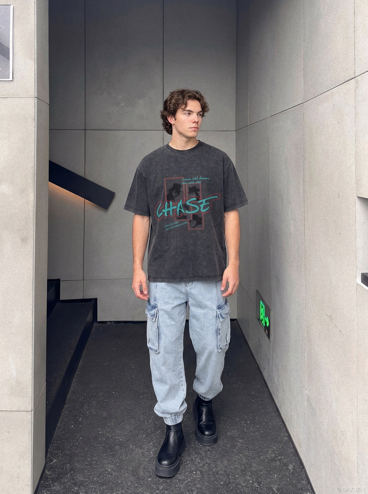 Close-up of faded pixel print on oversized graphic T-shirt