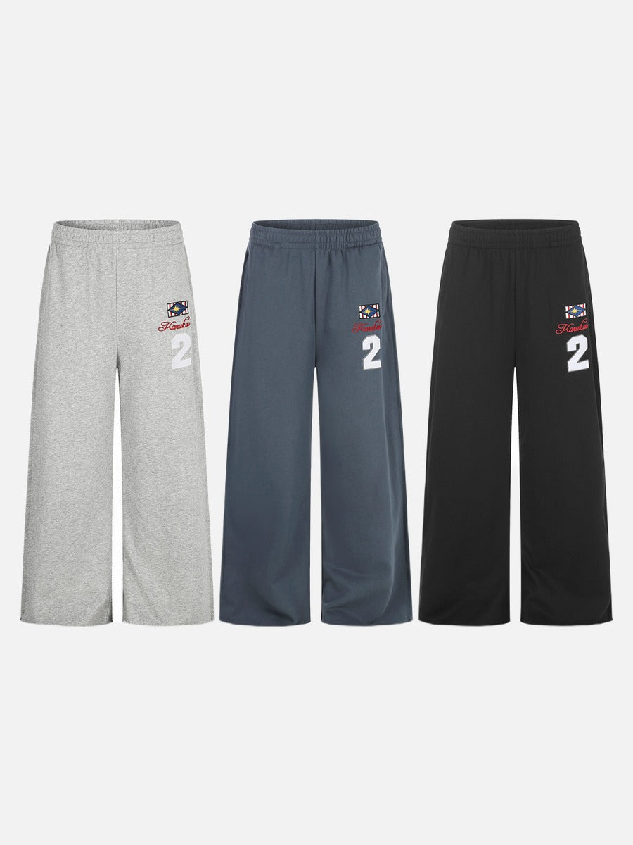 Wide-leg graphic sweatpants with elastic waistband detail