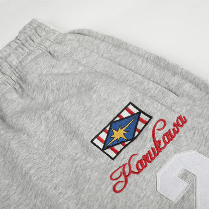 Wide-leg graphic sweatpants showing full-length drape and shape