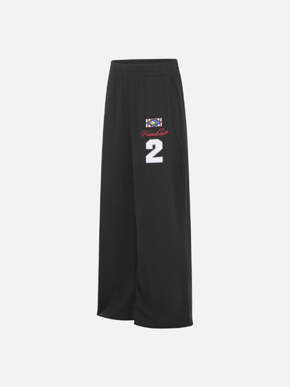 Close-up of leg graphic detail on wide-leg sweatpants