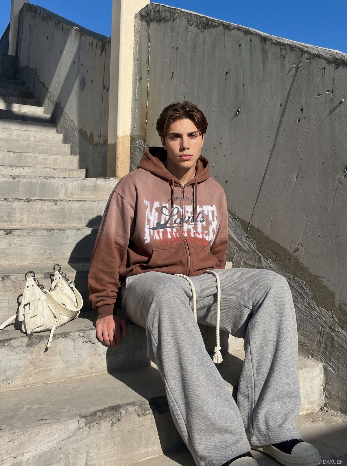 Gradient hooded jacket showing its layered graphic design