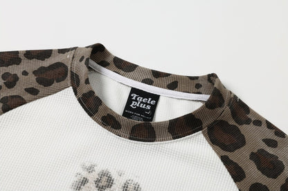 Casual long-sleeve T-shirt with leopard print and a faith-inspired cross graphic
