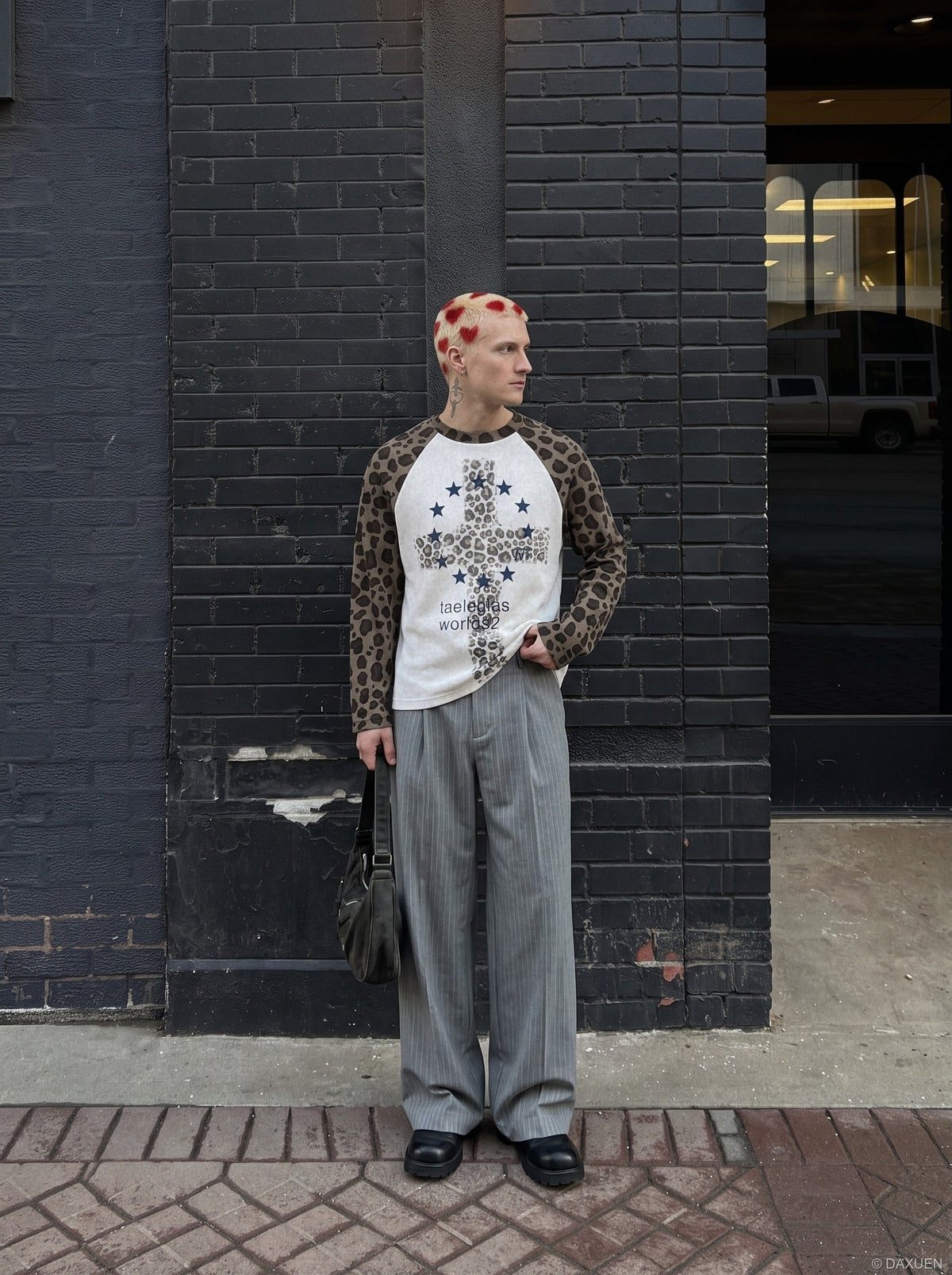Front view of a leopard print cross graphic long-sleeve T-shirt