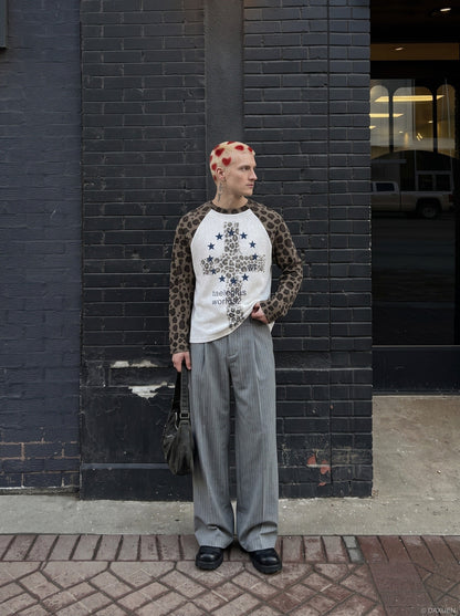 Front view of a leopard print cross graphic long-sleeve T-shirt