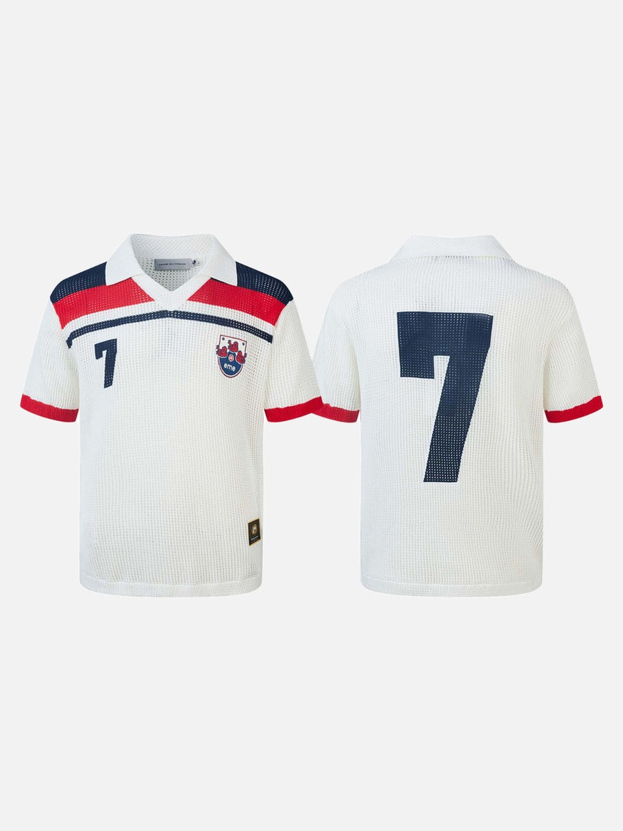 Full product image of navy open-knit polo shirt with red and white detailing