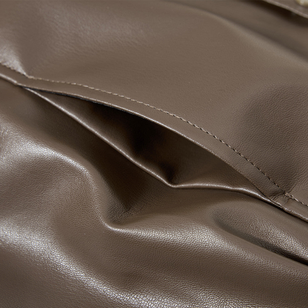 Close-up of the ribbed cuffs on the oversized bomber jacket