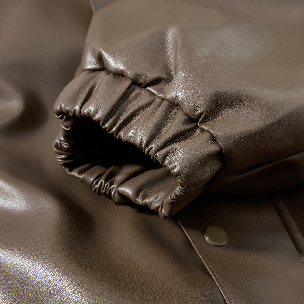 Black faux leather bomber jacket styled with a casual outfit
