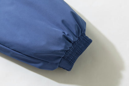 Detail of the gathered ruched fabric on the bomber jacket sleeve