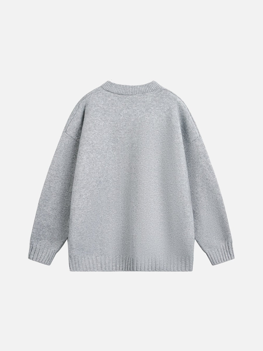 Oversized light grey jumper styled for a casual outfit