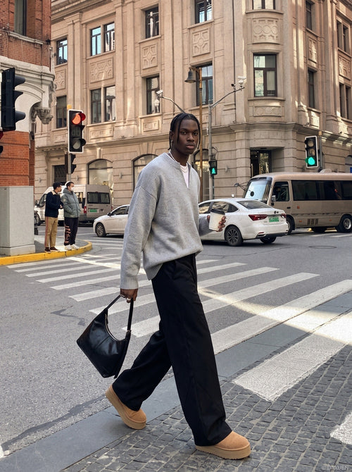 Oversized light grey knit jumper displayed from the front